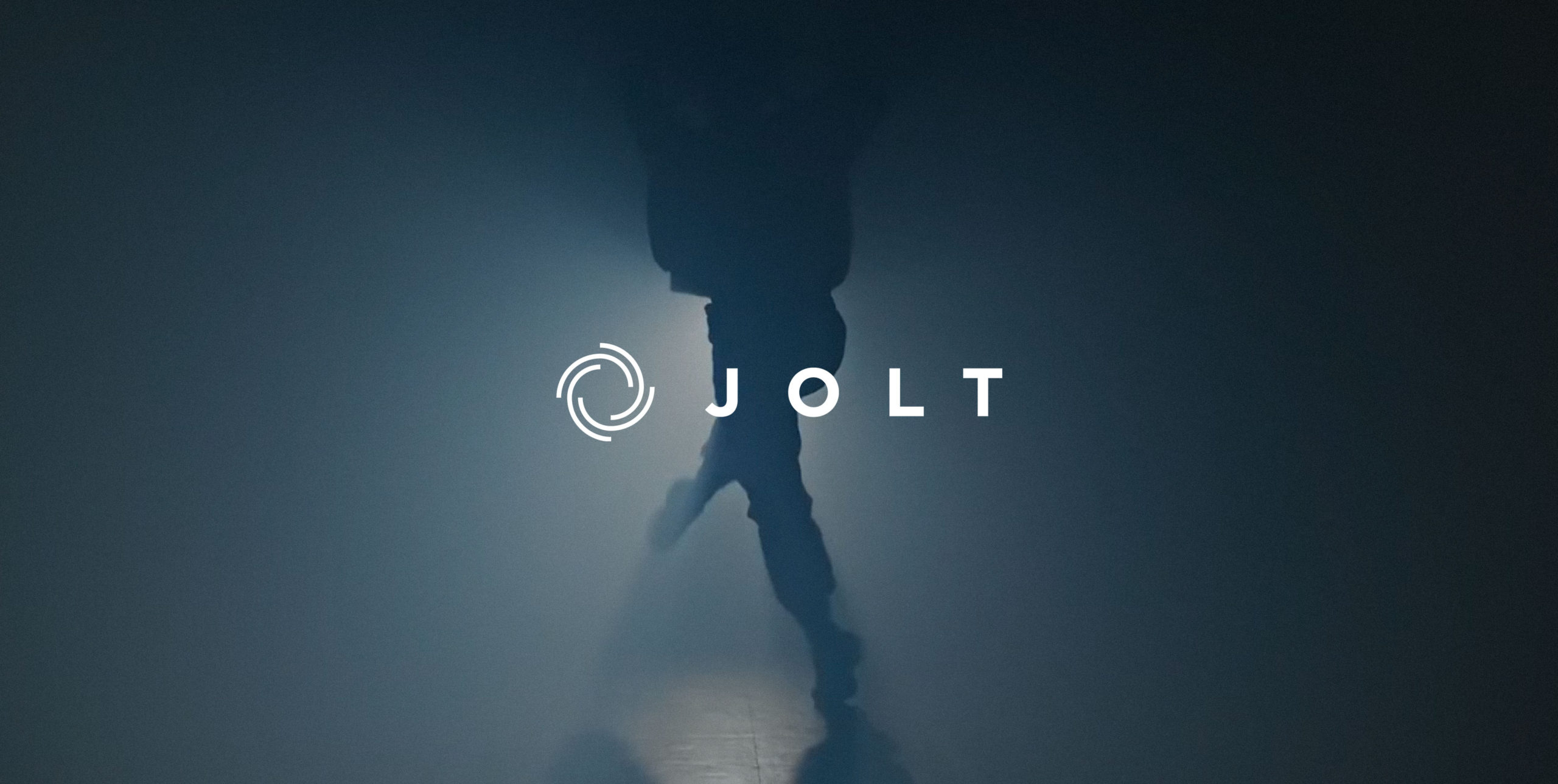 Man dancing in background with JOLT brandmark displayed above a black opacity
